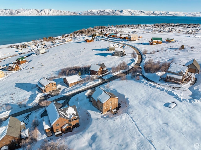 689 N Cambry Dr, Garden City, UT 84028 - snowy aerial view featuring a water and mountain view