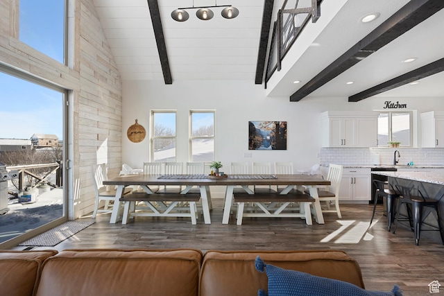 689 N Cambry Dr, Garden City, UT 84028 - dining room with dark wood finished floors, beamed ceiling, recessed lighting, and high vaulted ceiling
