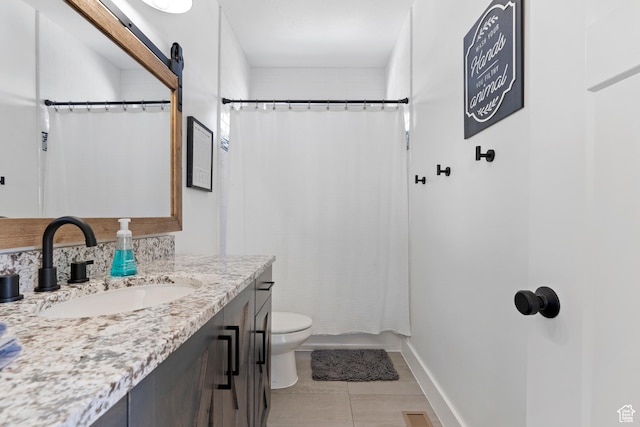 689 N Cambry Dr, Garden City, UT 84028 - bathroom with vanity, toilet, tile patterned floors, shower / tub combo, and baseboards