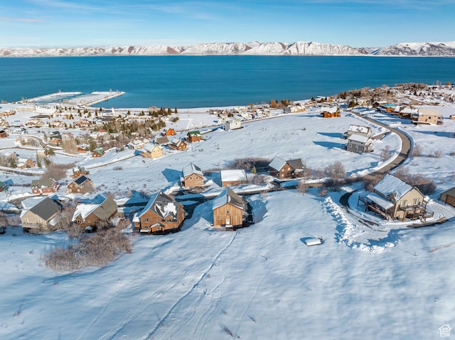 689 N Cambry Dr, Garden City, UT 84028 - snowy aerial view with a water and mountain view