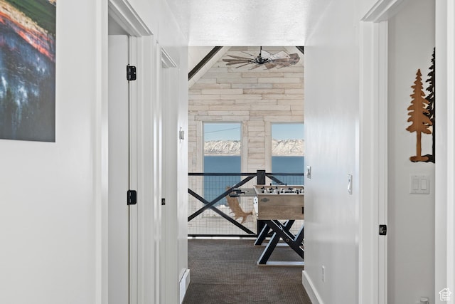689 N Cambry Dr, Garden City, UT 84028 - hallway with carpet floors, a water view, and baseboards