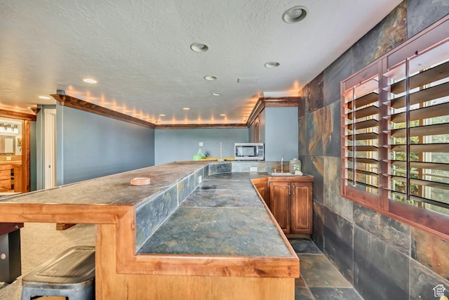 804 E 3300 N, North Ogden, UT 84414 - kitchen featuring stainless steel microwave, a peninsula, recessed lighting, a sink, and dark countertops
