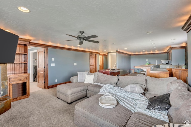 804 E 3300 N, North Ogden, UT 84414 - living area with light colored carpet, ceiling fan, recessed lighting, and crown molding