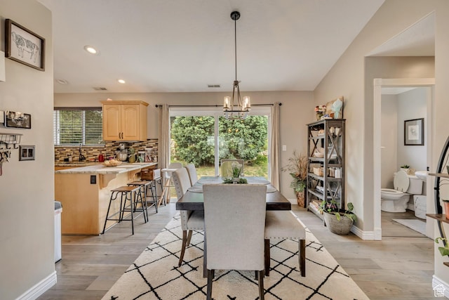 804 E 3300 N, North Ogden, UT 84414 - dining space featuring light wood finished floors, a chandelier, recessed lighting, and baseboards