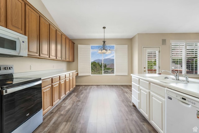 1267 E Hickenlooper Way S, Draper, UT 84020 - kitchen featuring white appliances, a chandelier, a sink, dark wood-style flooring, and baseboards