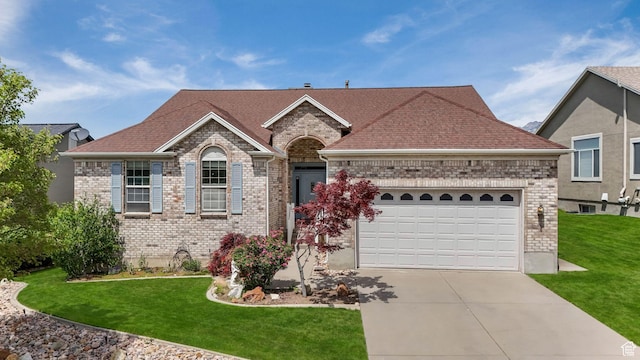1267 E Hickenlooper Way S, Draper, UT 84020 - view of front of home with driveway, brick siding, a garage, a front lawn, and a shingled roof