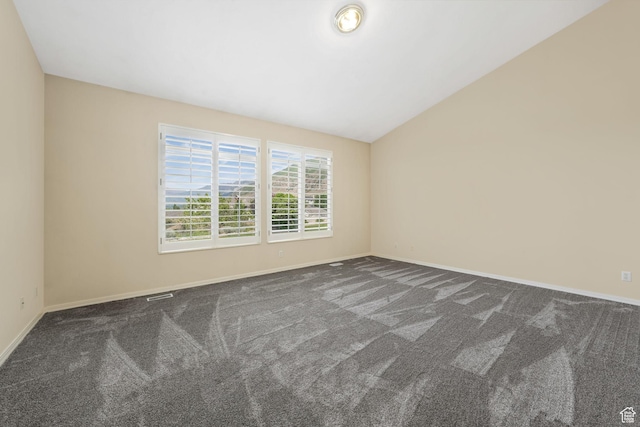 1267 E Hickenlooper Way S, Draper, UT 84020 - empty room featuring dark colored carpet, baseboards, and lofted ceiling