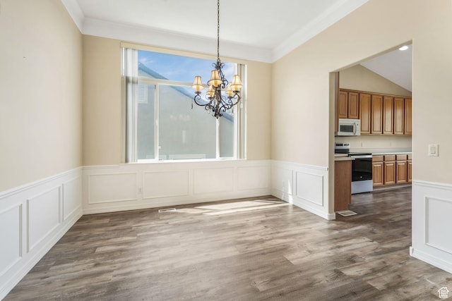 1267 E Hickenlooper Way S, Draper, UT 84020 - unfurnished dining area with a chandelier, a decorative wall, crown molding, wainscoting, and dark wood-type flooring