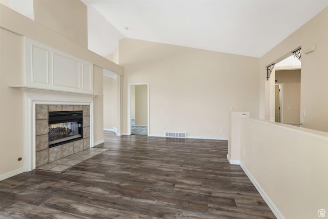 1267 E Hickenlooper Way S, Draper, UT 84020 - unfurnished living room featuring lofted ceiling, dark wood-style floors, a fireplace, and baseboards