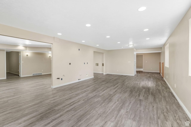 1267 E Hickenlooper Way S, Draper, UT 84020 - unfurnished living room with recessed lighting, baseboards, and light wood-style flooring