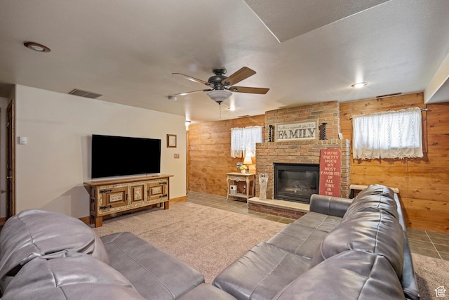 14745 N 8375 E, Spring City, UT 84662 - living room with wooden walls, a ceiling fan, a brick fireplace, tile patterned flooring, and baseboards