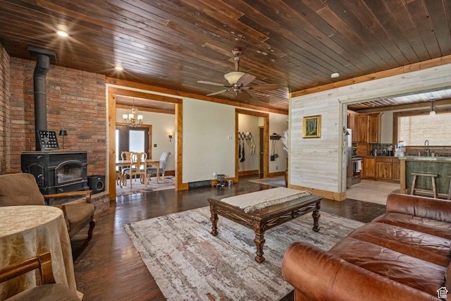 14745 N 8375 E, Spring City, UT 84662 - living room featuring wood ceiling, a wood stove, ceiling fan, a chandelier, and light wood-style floors