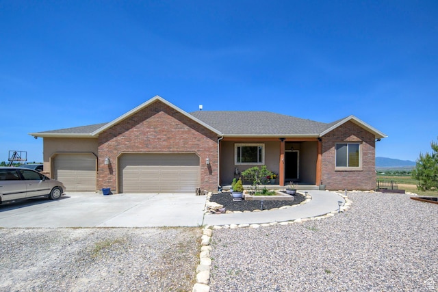 14745 N 8375 E, Spring City, UT 84662 - ranch-style house featuring an attached garage, concrete driveway, and brick siding