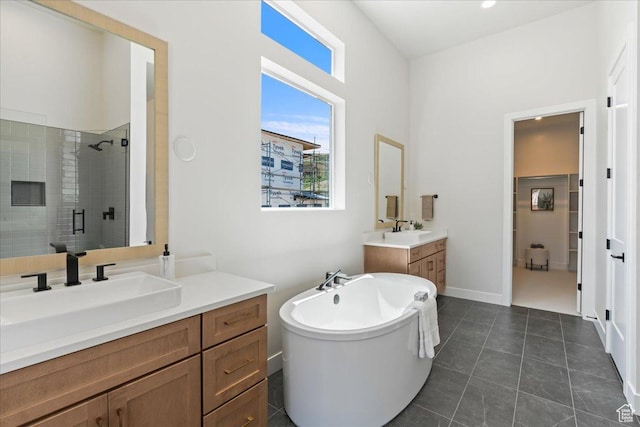 5854 N Fox Canyon Rd, Lehi, UT 84043 - full bathroom featuring a shower stall, two vanities, a freestanding tub, and tile patterned floors