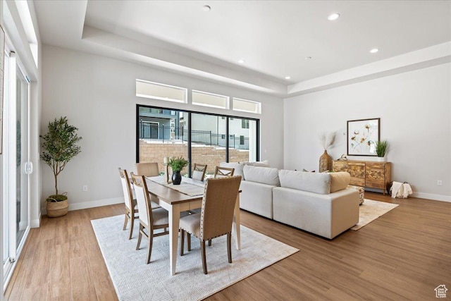 5854 N Fox Canyon Rd, Lehi, UT 84043 - dining area with a raised ceiling, recessed lighting, wood finished floors, and baseboards