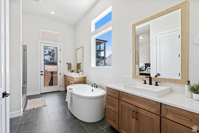 5854 N Fox Canyon Rd, Lehi, UT 84043 - bathroom with two vanities, a shower stall, a freestanding bath, tile patterned flooring, and baseboards