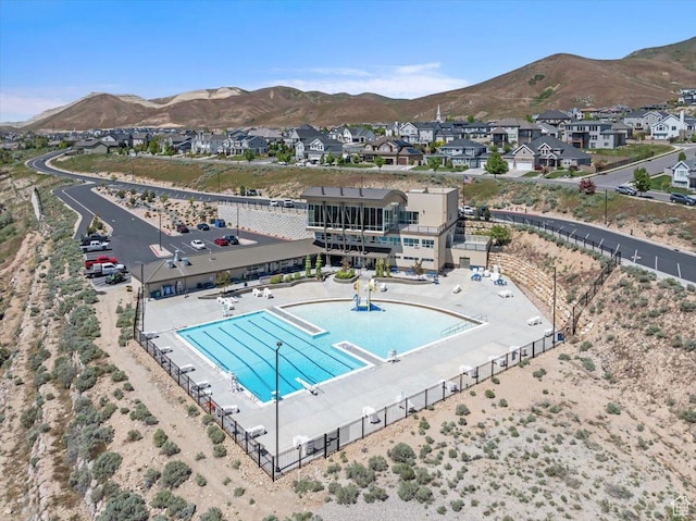 5854 N Fox Canyon Rd, Lehi, UT 84043 - aerial perspective of suburban area with a pool area and mountains