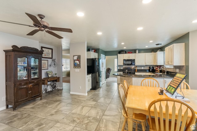5029 W Copper Meadow Ln S, West Jordan, UT 84088 - kitchen featuring black appliances, baseboards, a peninsula, recessed lighting, and a ceiling fan