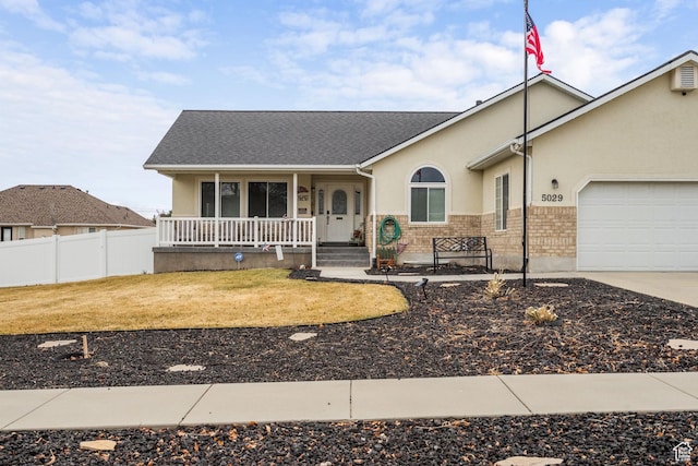 5029 W Copper Meadow Ln S, West Jordan, UT 84088 - ranch-style house with a porch, a garage, stucco siding, driveway, and roof with shingles
