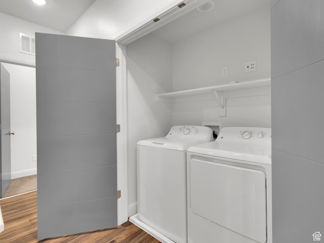 1618 E 3300 S, Millcreek, UT 84106 - laundry room with washer and dryer, wood finished floors, and baseboards