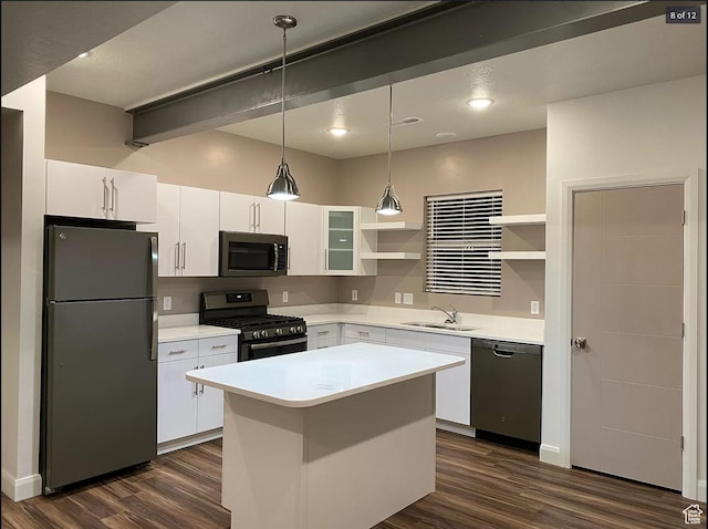 1618 E 3300 S, Millcreek, UT 84106 - kitchen with stainless steel appliances, open shelves, a sink, dark wood finished floors, and white cabinetry