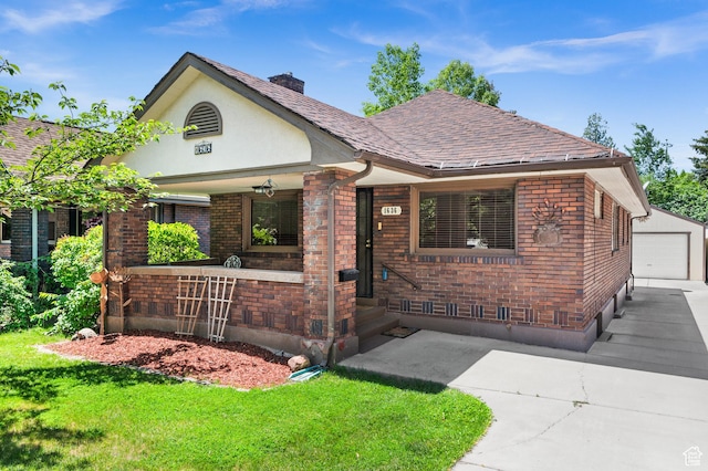 1636 S 1400 E, Salt Lake City, UT 84105 - tudor house featuring brick siding, a front lawn, a garage, an outbuilding, and a chimney