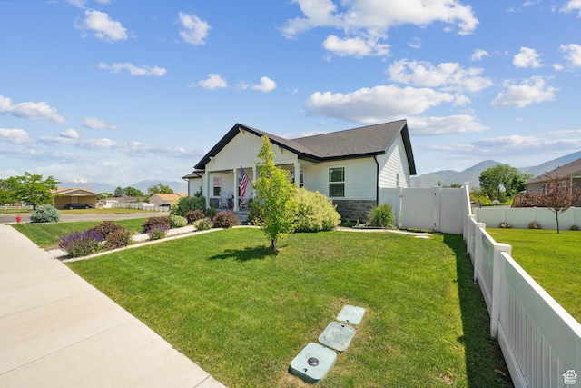 384 N 600 E, Payson, UT 84651 - view of front of home with stone siding, covered porch, roof with shingles, and a mountain view