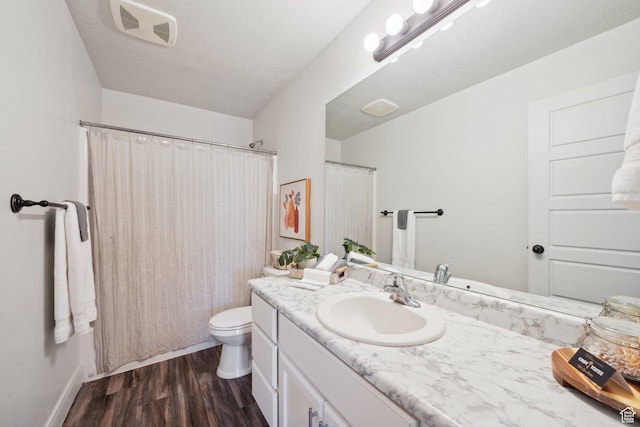 384 N 600 E, Payson, UT 84651 - bathroom with vanity, toilet, wood finished floors, baseboards, and a shower with shower curtain