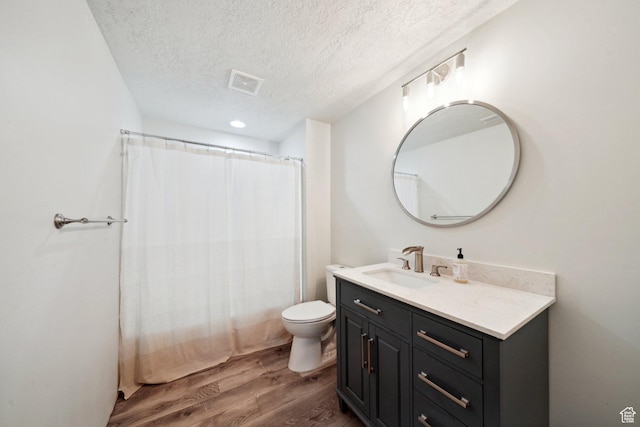384 N 600 E, Payson, UT 84651 - bathroom with a textured ceiling, wood finished floors, vanity, and toilet