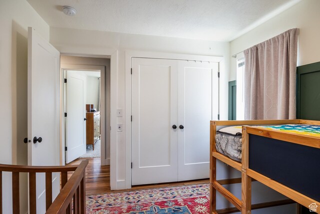 1217 Talisman Dr, Salt Lake City, UT 84116 - bedroom featuring wood finished floors and a closet