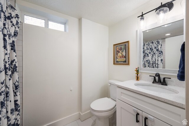 1217 Talisman Dr, Salt Lake City, UT 84116 - full bath featuring vanity, toilet, tile patterned flooring, and a textured ceiling