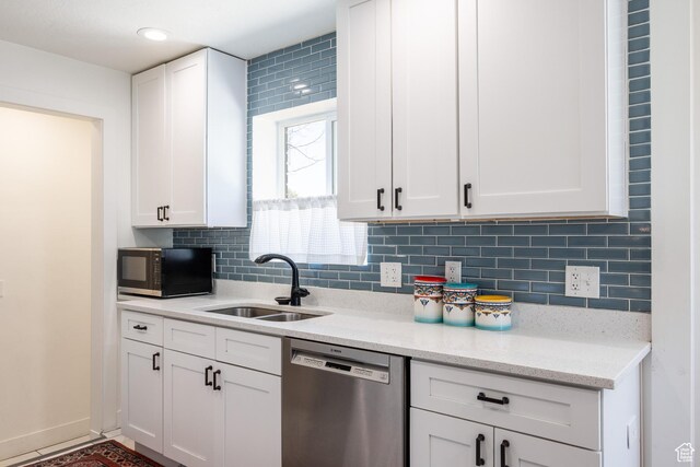 1217 Talisman Dr, Salt Lake City, UT 84116 - kitchen with dishwasher, a sink, black microwave, and white cabinetry