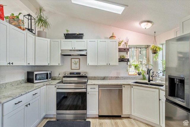 1687 Kylee Ln, Ogden, UT 84404 - kitchen featuring stainless steel appliances, under cabinet range hood, vaulted ceiling, a sink, and open shelves