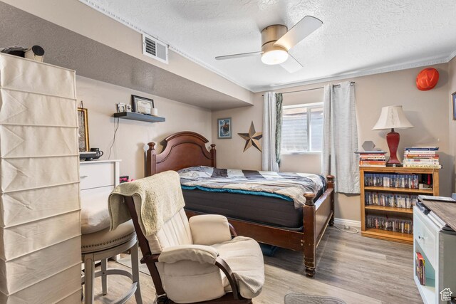 8265 S 3450 W, West Jordan, UT 84088 - bedroom with wood finished floors, a textured ceiling, a ceiling fan, and baseboards
