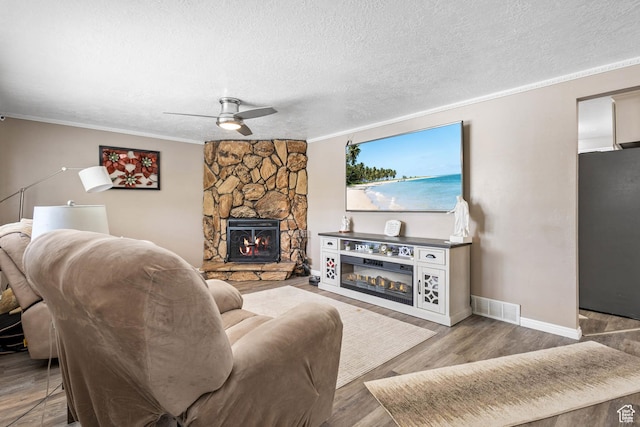 8265 S 3450 W, West Jordan, UT 84088 - living area featuring a ceiling fan, ornamental molding, wood finished floors, baseboards, and a fireplace