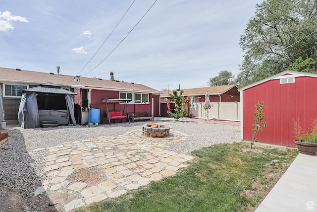 8265 S 3450 W, West Jordan, UT 84088 - fenced yard with a fire pit, a gazebo, and a patio