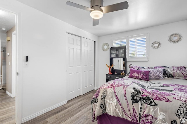 8265 S 3450 W, West Jordan, UT 84088 - bedroom featuring light wood-style floors, a closet, baseboards, and ceiling fan