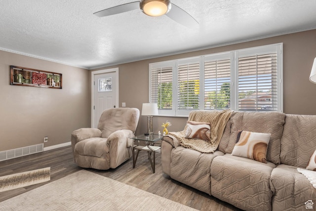 8265 S 3450 W, West Jordan, UT 84088 - living area with wood finished floors, a textured ceiling, ceiling fan, baseboards, and crown molding