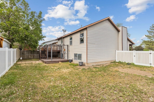 4478 S Balmoral Way, West Valley City, UT 84119 - rear view of property featuring a wooden deck and a gate