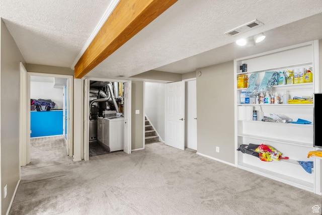 4478 S Balmoral Way, West Valley City, UT 84119 - finished basement featuring a textured ceiling, carpet flooring, washing machine and clothes dryer, baseboards, and stairway