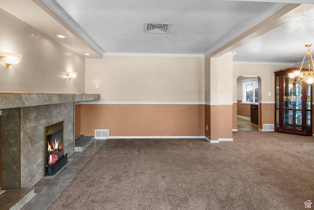 1979 S 600 E, Salt Lake City, UT 84105 - unfurnished living room with a textured ceiling, arched walkways, a fireplace, ornamental molding, and baseboards