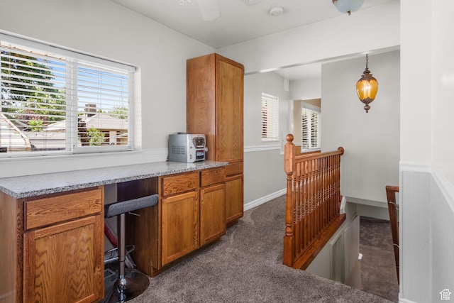 1979 S 600 E, Salt Lake City, UT 84105 - office space featuring dark colored carpet, plenty of natural light, built in desk, and ceiling fan