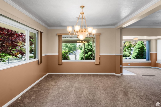 1979 S 600 E, Salt Lake City, UT 84105 - carpeted empty room featuring plenty of natural light, a chandelier, baseboards, ornamental molding, and a textured ceiling