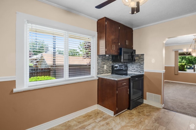 1979 S 600 E, Salt Lake City, UT 84105 - kitchen with black appliances, baseboards, crown molding, ceiling fan, and tasteful backsplash