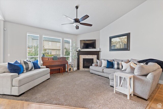 3352 N 200 W, Lehi, UT 84043 - living area featuring vaulted ceiling, ceiling fan, a glass covered fireplace, and light wood-style flooring