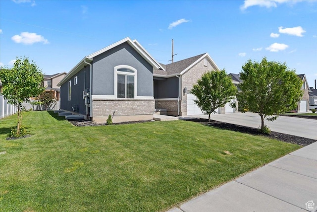 3352 N 200 W, Lehi, UT 84043 - single story home with an attached garage, concrete driveway, brick siding, and a front lawn