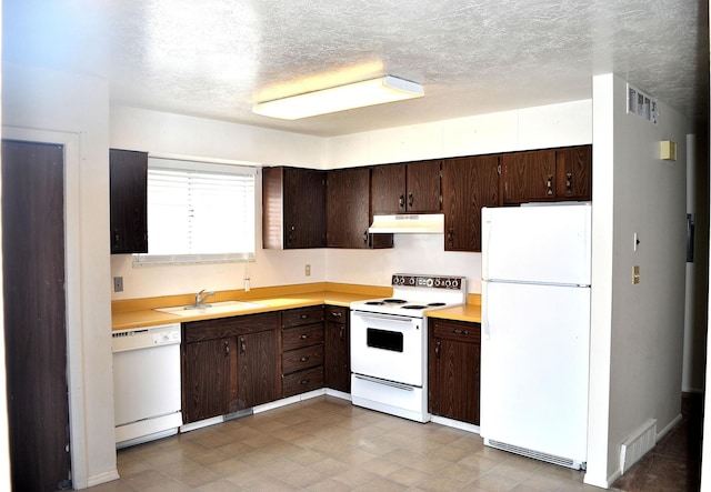 221 N Pingree Ave E, Ogden, UT 84404 - kitchen featuring white appliances, under cabinet range hood, a sink, light countertops, and a textured ceiling