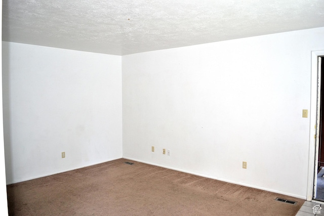 221 N Pingree Ave E, Ogden, UT 84404 - carpeted empty room featuring baseboards and a textured ceiling