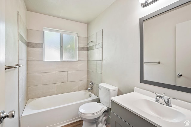 221 N Pingree Ave E, Ogden, UT 84404 - bathroom with toilet, vanity, tub / shower combination, and wood finished floors