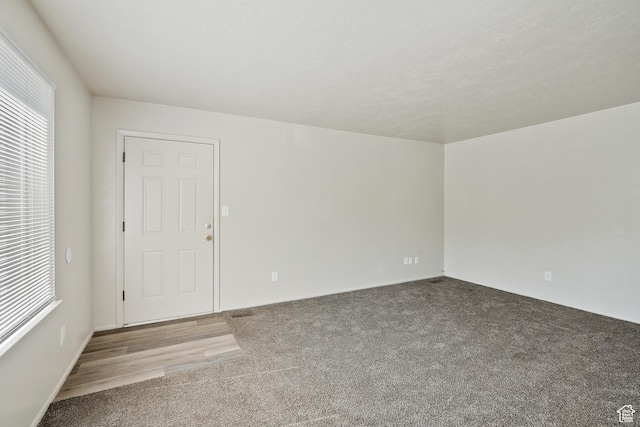221 N Pingree Ave E, Ogden, UT 84404 - carpeted empty room with plenty of natural light and baseboards